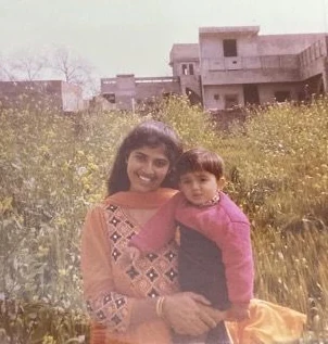 With my mom among the flowers.
