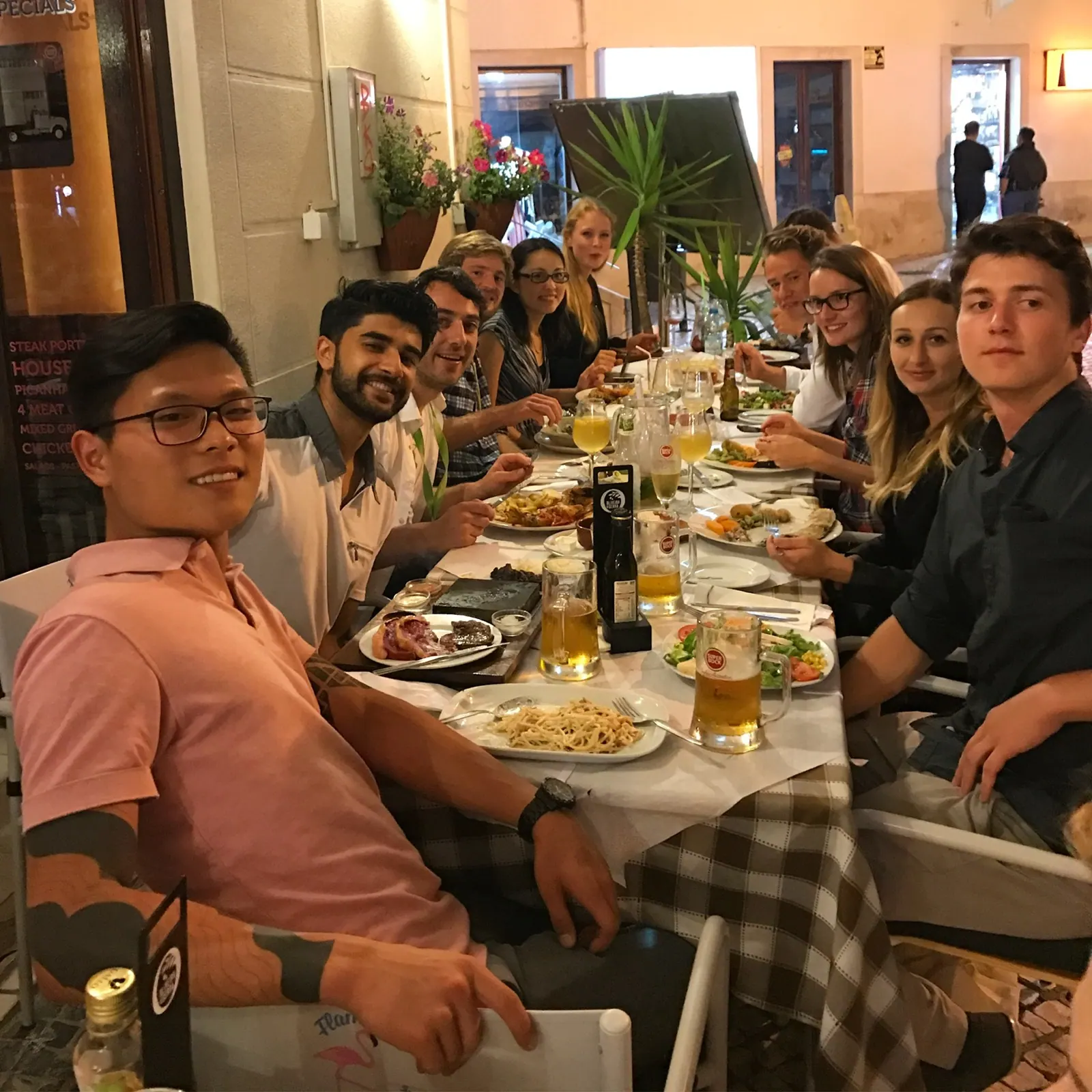 A group seated around a dining table.