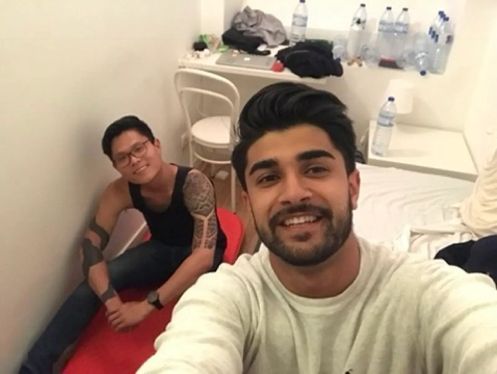 A selfie in a small bedroom.